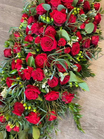 Red rose casket spray